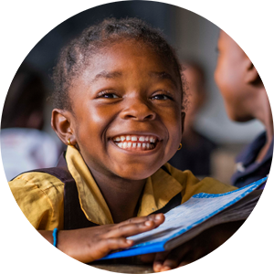 Child smiling while reading